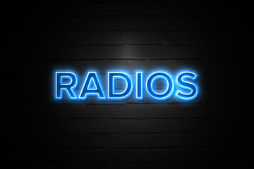 Obraz premium Radios neon Sign on brickwall