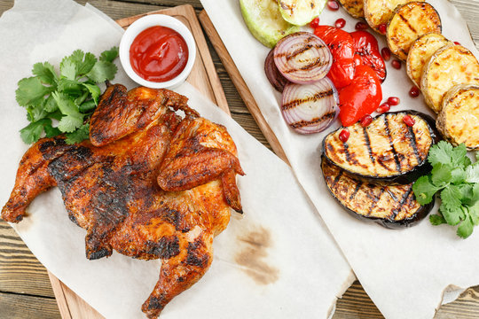 grilled chicken. Serving on a wooden Board on a rustic table. Barbecue restaurant menu, a series of photos of different meats