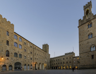 Obraz premium Pretorio Palace and Porcellino Tower, Priori square in a quiet moment of the evening, Volterra, Pisa, Tuscany, Italy