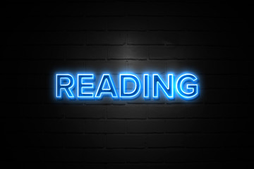 Reading neon Sign on brickwall