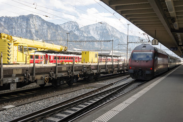 Fototapeta na wymiar Train station and trains in the alps switzerland