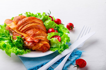 Fresh Croissant Sandwich with  Ham, Cheese,Cherry tomatoes and Salad leaf  Breakfast  Delicious Baking  Light Meal