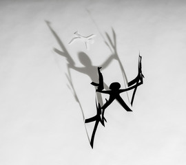 Terrorism, victim. Paper figures with automatic guns.