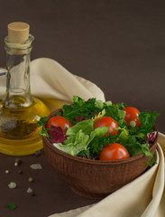 Fresh salad with cherry tomatoes, herbs, olive oil - delicious diet