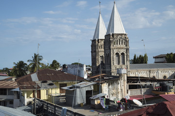 Fototapeta na wymiar Catholic Church and roofs, Old town, Stone Town,Zanzibar 