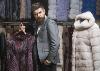 Man with beard and mustache in fur shop.