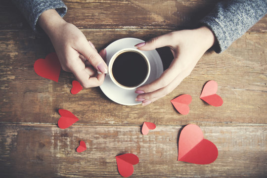 woman hand coffee and heart