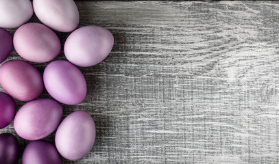 Easter eggs in fashionable colors on a gray wooden background