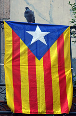 Flag of Catalonia on a balcony in Barcelona