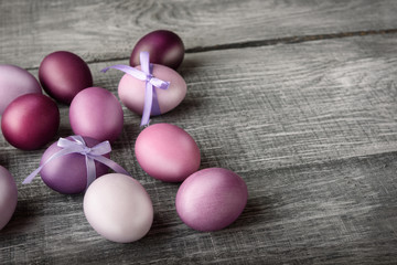 Easter eggs in fashionable colors on a gray wooden background