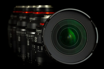 Fototapeta na wymiar Professional Cinema Lens - concept of camera lenses on the mirroring black background.