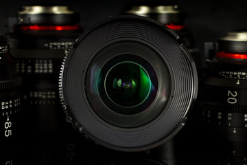 Professional Cinema Lens - concept of camera lenses on the mirroring black background.