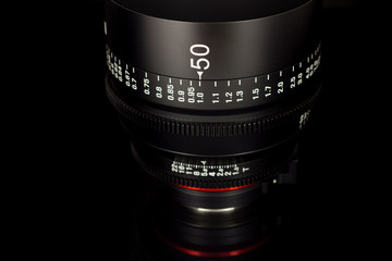 Professional Cinema Lens - concept of camera lenses on the mirroring black background.