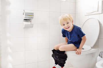 Cute little boy in restroom