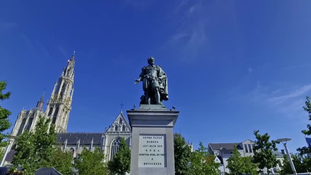 Rubens statue in Antwerp, Belgium in a sunny day. Cathedral of Our Lady in the background.