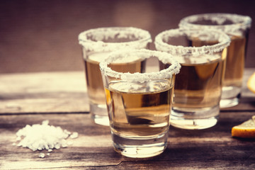 Tequila shots with lime fruits and salt 