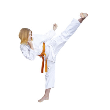 Adult female athlete in karategi is beating blow hand against a white background
