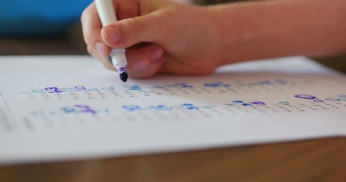 Child Doing Math Homework with Purple Marker, 4K