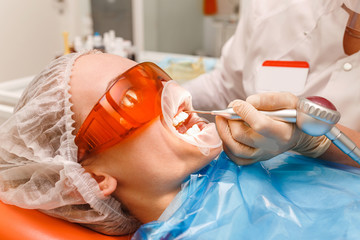 Woman at the dentist's chair during a stomatology procedure
