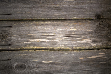 gray aged boards from a fence horizontally