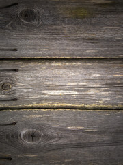 gray aged boards from a fence vertically