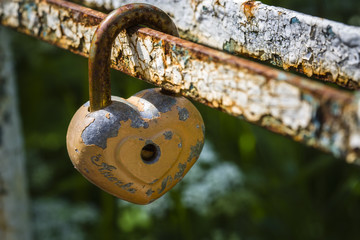 wedding door lock in the shape of a heart on the bridge