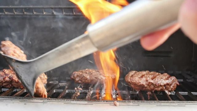 Grilling Hamburgers and Flipping Burgers in Slow Motion
