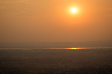 Beautiful sunset in Mandalay, Myanmar (Burma), viewed from above from the Mandalay Hill. Copy space.
