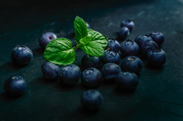 Blueberry fruit on stone background. Healthy forest fruit. Delicious fresh berries.