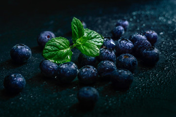 Blueberry fruit on stone background. Healthy forest fruit. Delicious fresh berries.