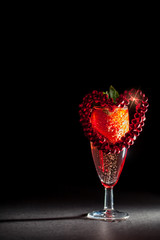 Valentines day breakfast. Pink Champagne with strawberry red love heart.