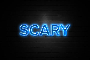Scary neon Sign on brickwall