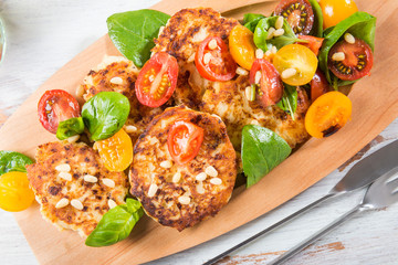 Ricotta pancakes with spinach, tomatoes, basil and pine nuts sal