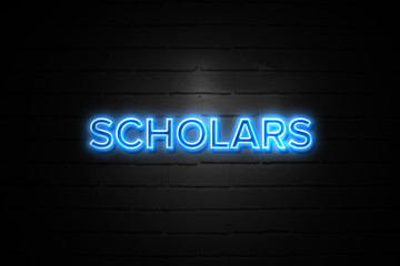 Scholars neon Sign on brickwall
