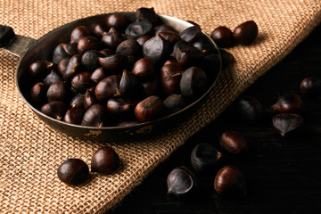 Roasted chestnuts on cooking pan
