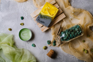 Spa accessories . Aromatic stones, cream, handmade soap. Flat lay.