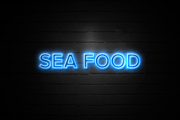 Obraz premium Sea Food neon Sign on brickwall