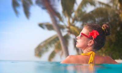 young beautiful woman relaxing in spa pool