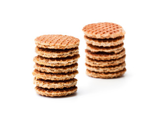 Stack  of mini dutch caramel waffles isolated