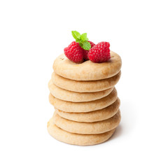 stack  of homemade cookies with raspberries isolated on white background