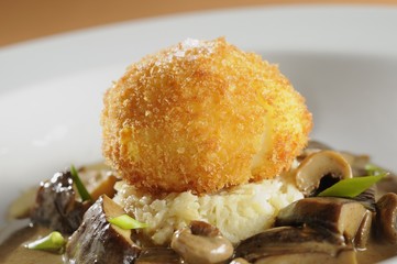 Breaded Egg with Mushrooms sauce