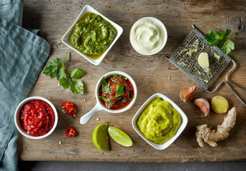 various sauces on wooden table