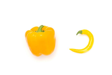 Mix of yellow peppers against a white background