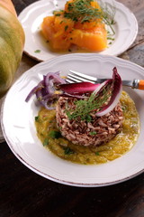 Dishes of risotto and cereals and pumpkin and herbs