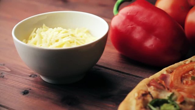 Hresh Hot Pizza and food ingredients on wooden table, macro shot, close up