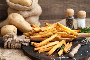 french fries, fast food french potatoes with skin served with salt and herbs