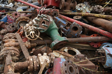 Large colorful pile of discarded industrial scrap iron metals for recycling. 