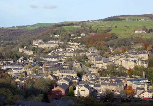 panoramic aerial view of the town of hebden bridge in west yorkshire showing the streets houses and old mill buildings set in the surrounding pennine hills