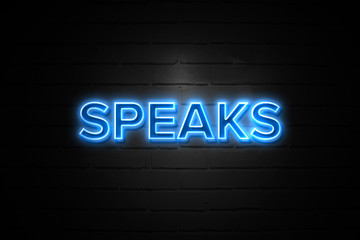 Obraz premium Speaks neon Sign on brickwall