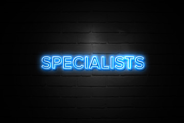 Obraz premium Specialists neon Sign on brickwall